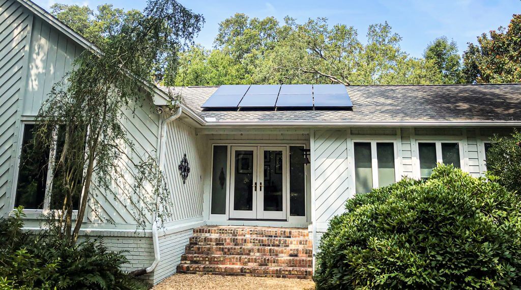 Solar panels on top of a house in Gulf Breeze, Florida. Solar is a great way to help you save money on your power bills, and reduce your reliance on the grid.