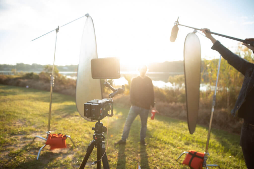 Southern Creative crew members help with set up on the morning of an interview during our brand story/solar + storage project shoot.