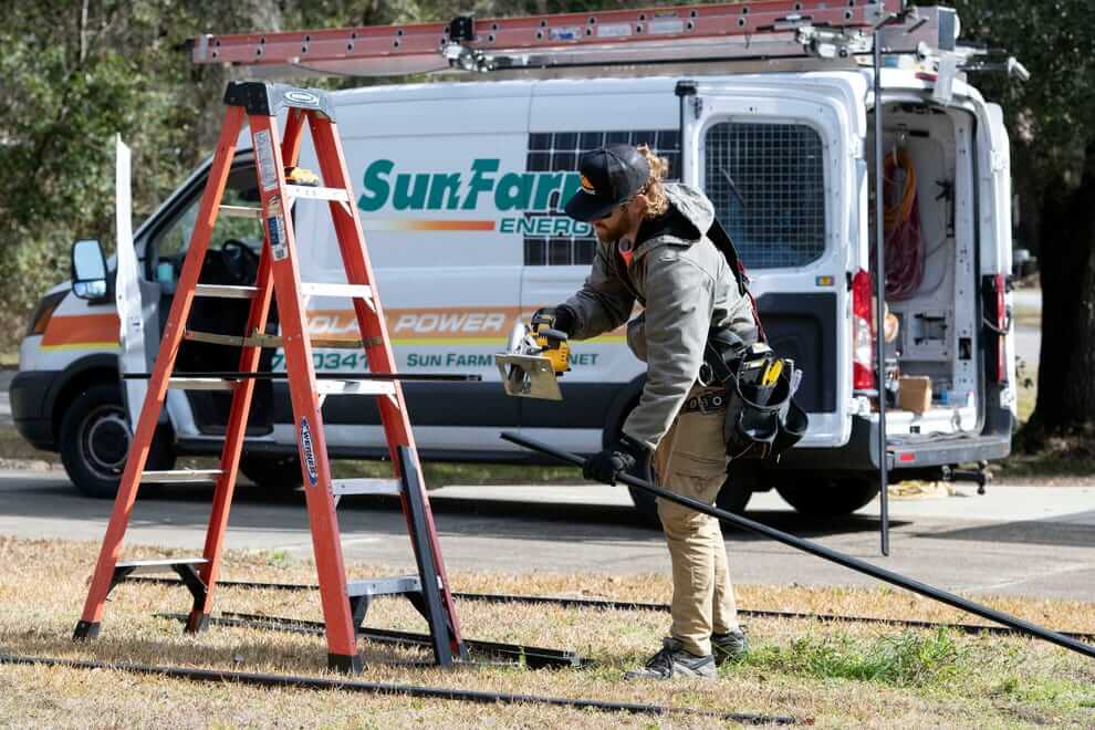 Keep your system running smoothly with solar evaluation reports from SunFarm Energy. A SunFarm Energy installer works on fitting system components.