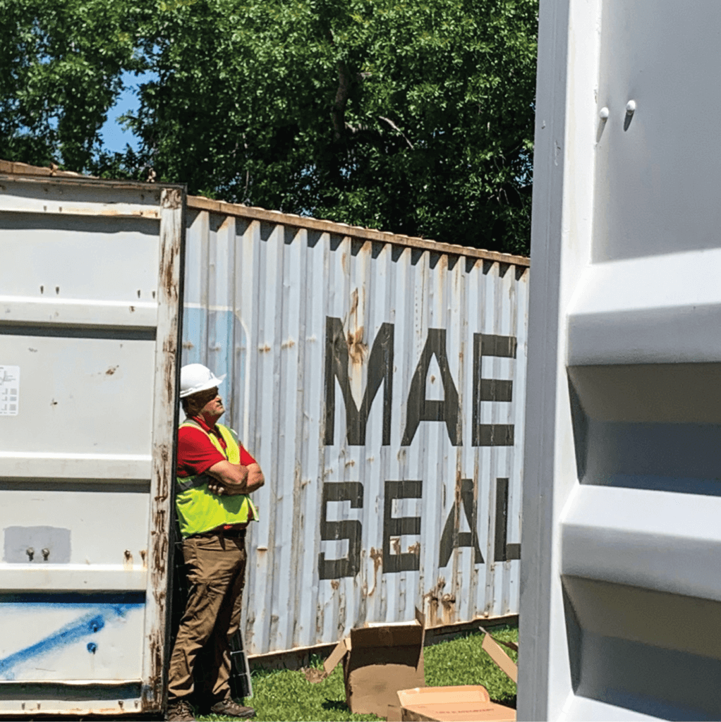 Brian Copes looks on as SunFarm Energy crews work on the solar array. 