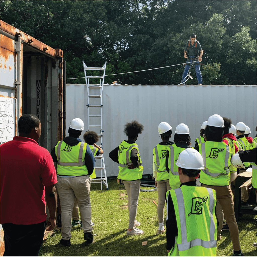 SunFarm Energy crews show Chickasaw students the solar installation process. 